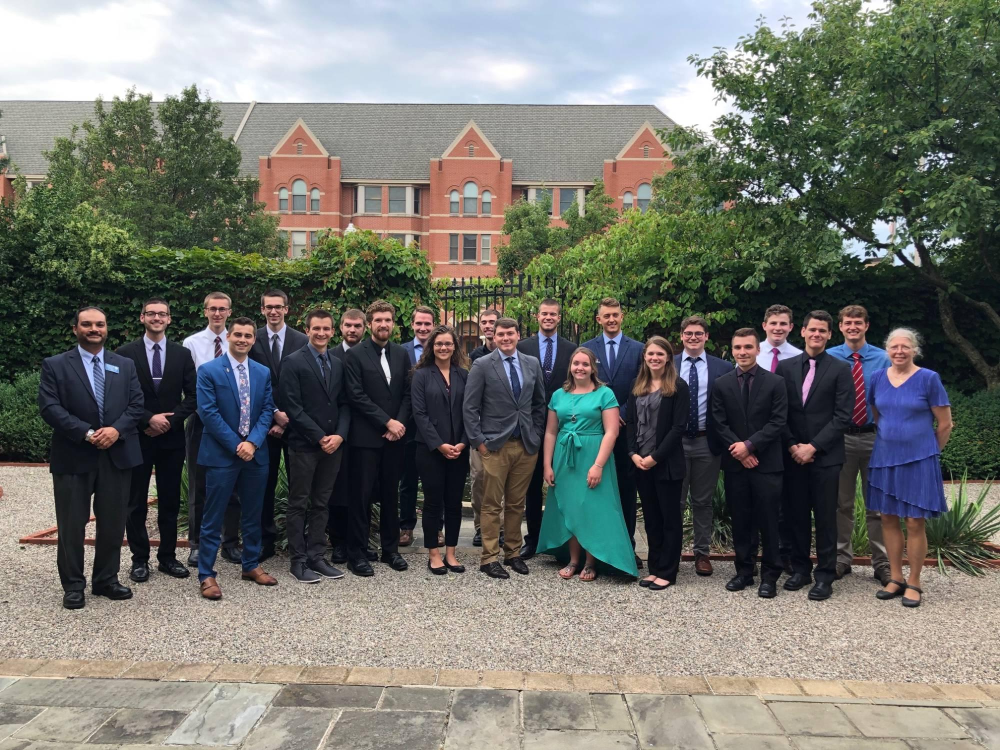 Students outside in formal attire